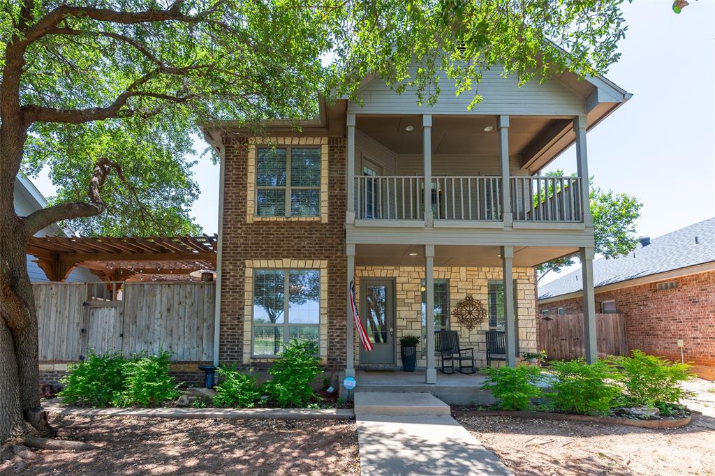 A 2005 built brick and rock home nestled in an established Abilene neighborhood offering 1,798 square feet of beautifully updated living space on a low maintenance 0.19 acre lot. This 3 bedroom, 2.5 bathroom two story home has been thoughtfully designed with comfort and style in mind.
The main level features a welcoming living area with a cozy fireplace, luxury vinyl plank flooring throughout, and a quaint kitchen with granite countertops, an eat in kitchen, and stainless steel appliances, including a refrigerator, dishwasher, oven range, and microwave. A separate formal dining room provides the perfect space for entertaining family and friends. A convenient half bathroom is located just off the kitchen and the stairway leading to the second level perfectly positioned for guests and everyday living. The primary bedroom is conveniently located on the ground floor and features a  walk in closet and ensuite bathroom complete with a walk-in shower, a jetted soaking tub, a sink, a small linen cabinet, and a private separate toilet closet. Every detail has been designed with comfort and privacy in mind. Upstairs you will find two spacious secondary bedrooms each with balcony doors opening to beautiful views, plus a full bathroom. Step outside to your own private backyard oasis featuring an in ground pool with a waterfall, a pergola perfect for entertaining, and a 2 car rear entry garage that keeps the front of the home clean and picture perfect.