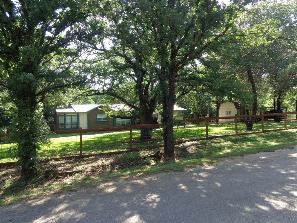 If you are looking to get away from the big cities, then take a look at this terrific home in the country on 2.59 acres. It is centrally located just off of FM 4 between Grandview, Texas and Cleburne, Texas. If you have children, it is in Grandview school district ranked #1 in Johnson County, Texas. GO ZEBRAS!!! If you are retired and looking to get away, it sits on a quiet cul-de-sac with very little traffic. It is 30 miles from Fort Worth and under an hour from Dallas if you need to travel for work. Updated with new shaker easy close cabinets, granite countertops, paint, flooring, and remodeled bathrooms. New metal roof was installed in 2015 and new HVAC installed inside and outside in 2020. It is fenced and cross fenced except an approximate 15-foot section. Double driveways for parking and a 2-car carport with an attached 14' x 20' workshop or storage building. Don't let this one get away! Book your showing today! I'm available 7 days a week. Sellers are motivated