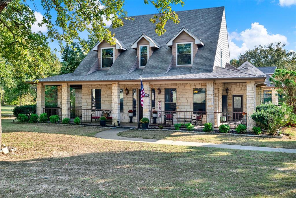 Experience the perfect balance of country serenity and modern luxury at 1166 Winding Wood Trail, a private retreat set on nearly 3 beautifully treed acres in the heart of Scurry. This updated two-story home offers exceptional privacy, space, and comfort while remaining conveniently located near Highway 175 for easy access to Kaufman, Forney and greater North Texas area.
From the moment you arrive, the peaceful setting, mature trees, and inviting curb appeal create a warm welcome. The landscaping is currently being revitalized for the spring season, enhancing the natural beauty of the property and the home’s already impressive outdoor presence.
The primary suite provides a private retreat with spa-inspired finishes, elegant tilework, and peaceful views of the surrounding landscape. Upstairs offers a spacious living area, large secondary bedrooms, and a fully updated ensuite, creating flexibility for guests, a home office, or multigenerational living. A large bonus room provides endless possibilities for a media room, gym, hobby space, or additional workspace.
Inside, wood floors, and abundant natural light create an open yet inviting atmosphere. The spacious kitchen features Bosch appliances, custom cabinetry, and generous prep space, making it ideal for entertaining or everyday living. A completely remodeled laundry room adds functionality with a sink and butcher block countertops.
Step outside to your own backyard oasis featuring a sparkling pool, patio for entertaining, and a fenced yard surrounded by mature trees. Recent upgrades include an architectural shingle roof, new AC units, upgraded irrigation system, new pool pump, and an electric vehicle charger, offering modern convenience and peace of mind.
1166 Winding Wood Trail isn’t just a home—it’s a private sanctuary designed for those who value space, privacy, and a lifestyle that allows them to truly disconnect from the noise of the world while remaining connected to everything North Texas has to offer.