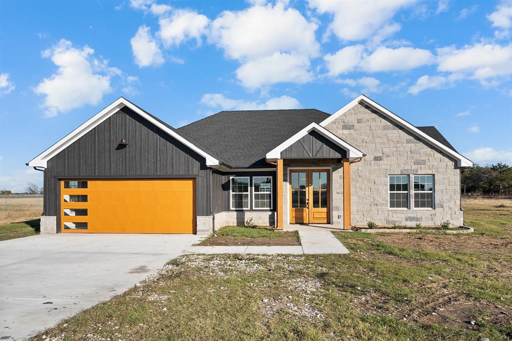 Welcome to your brand-new 2025 custom home on 1.2 acres in peaceful Kaufman! Step through the grand double wooden doors into an open concept floor plan featuring luxury vinyl plank flooring throughout, soaring ceilings, and an oversized island perfect for gatherings. The kitchen boasts plenty of prep space and modern finishes, seamlessly flowing into the living and dining areas for easy entertaining.

Enjoy covered front and back patios, ideal for morning coffee or relaxing evenings overlooking your private acreage. Built with efficiency and quality in mind, the home includes spray foam insulation and an aerobic septic system for long-term savings and comfort.

This beautifully designed new build combines modern style with country serenity just a short drive from downtown Kaufman.