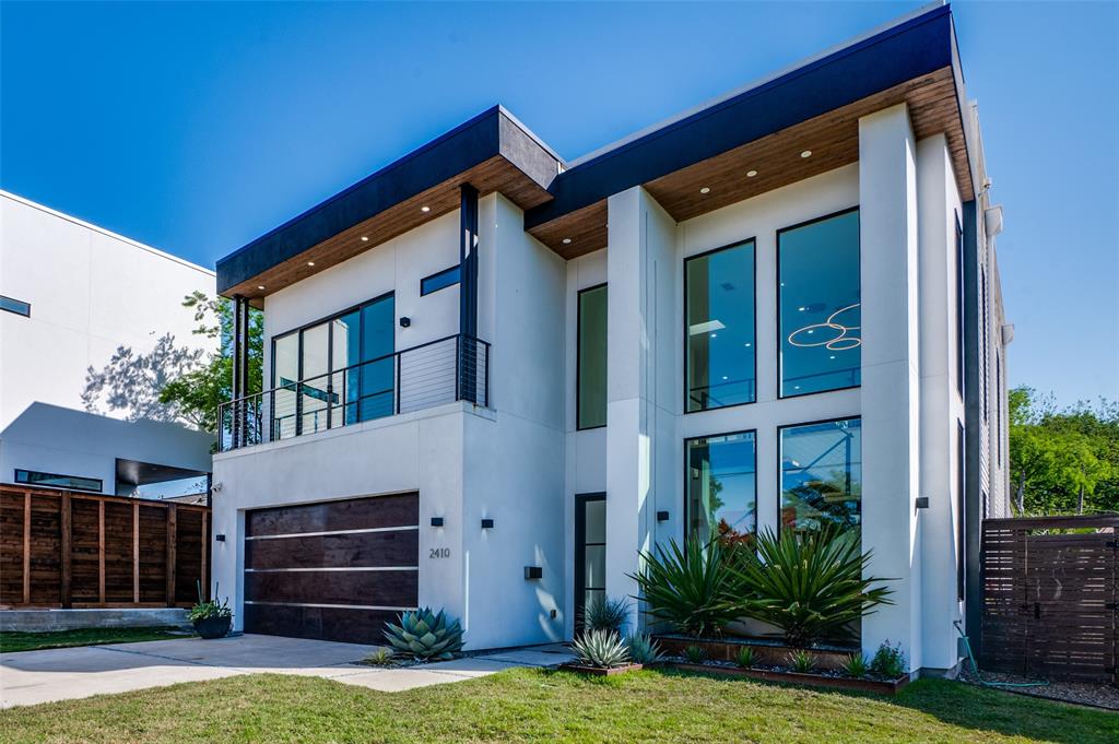 Stunning custom built contemporary oasis in Dallas. This builder’s personal residence boasts a 3 story layout featuring a rooftop deck with skyline views and an open floor plan. The Great Room, bathed in natural light, opens to a dream kitchen with bounteous cabinetry w walk-in pantry. Dual glass door walls connect to a patio w fireplace and  TV, extending the living space. This lanai, perfect for all seasons, features a retractable screen and overlooks a landscaped yard w lap pool, spa. The foyer showcases new hardwood floors w a floating staircase that rises up over a Zen water feature.  Upstairs, find a game room, office with serene views and exquisite master suite with luxurious bath, sauna, and large walk-in closet. Outdoor living peaks with a rooftop deck equipped for entertainment, complete with grill, putting green, and solar panels. A separate guest house offers a bedroom and a steam bath. Prime location, minutes from Katy Trail, American Airlines Stadium, and White Rock Lake.
