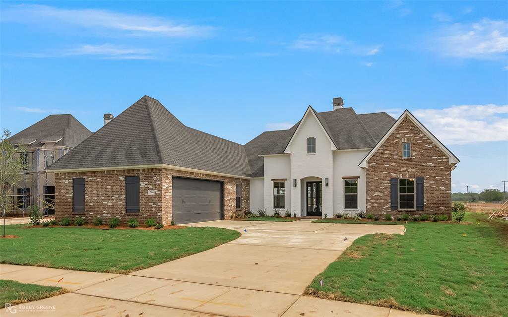 HELLO GORGEOUS New Build in North Bossier! Proudly introducing you to unit 2 of Waterford Lake located directly behind Legacy Elementary off Swan Lake Road, this gorgeous home is COMPLETE and ready to call home for the Holidays! 706 Calcasieu Pass is a one floor, custom home with 4 bedrooms, 3 bathrooms, 2418 square feet, a formal dining area, and so many features to love. Sollevare Homes builds a top tier home and you'll recognize it from the second you enter the front door! Enjoy gorgeous views of Waterford Lake from the full glass double front doors, dining room, and 2 of the bedrooms - the sunsets are to die for! Trendy gold hardware and light fixtures, striking marble and quartzite countertops, light oak engineered wood floors, oversized kitchen island with custom cabinetry and drawers, large back patio with grill and sink, hard wired security system, and full sprinkler system! Don't miss this one! FULL WOOD FENCE ALREADY INSTALLED!