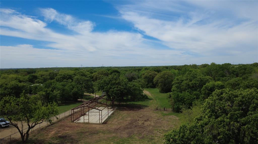 Gorgeous almost 4 acre partially cleared lot! Come build your dream ranch! Build your barndominium or bring your MOBILE HOME. Property is quiet and conveniently located near I35, FM 917, and HWY 67. Outside city limits, only know restrictions are no junk yards. Needs septic, electric installed, and Bethany Water is available at the road. There is a a partial frame structure ready to be competed for a barn, shop, or barndo.