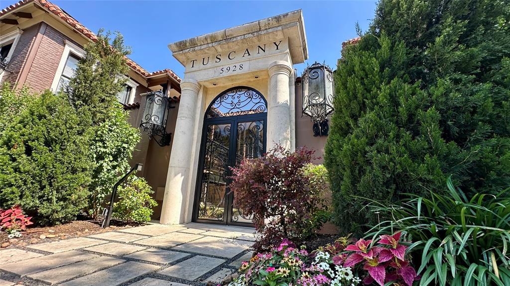 Rarely available FIRST-FLOOR corner residence in the highly sought-after Tuscany Condominiums, offering an exceptional blend of comfort, style, and convenience in one of Dallas’ most desirable locations. This beautifully updated 2-bedroom, 2-bath condo features engineered wood flooring throughout, fresh interior paint, abundant natural light, and a thoughtfully designed open-concept layout ideal for everyday living and entertaining.

The inviting living area is anchored by a striking double-sided fireplace that seamlessly connects the living, dining, and kitchen spaces. The kitchen offers stainless steel appliances, granite countertops, generous prep space, and a functional layout designed for easy living. Newly replaced French doors enhance both the aesthetic appeal and energy efficiency of the home while providing access to the spacious private patio—perfect for entertaining, relaxing, or pets.

The spacious primary suite features a large walk-in closet and ensuite bath, while the secondary bedroom offers flexibility for guests, a home office, or additional living space. Refrigerator, full-size washer, and dryer are included. Two assigned covered parking spaces are located directly behind the gated private backyard, offering a rare convenience.
Tuscany Condominiums recently completed an impressive $900K community-wide renovation and offers resort-style amenities including a sparkling pool with separate hot tub, fitness center, grilling stations, fountains, beautifully landscaped courtyards, and secure gated access.

Ideally located near SMU, Central Market, Lower Greenville, Mockingbird Station, White Rock Lake, Katy Trail access via Ridgewood Trail, and major commuter routes, this home offers exceptional access to Dallas’ premier dining, shopping, entertainment, and outdoor recreation. A rare opportunity to enjoy low-maintenance living in one of Dallas’ most desirable gated communities.