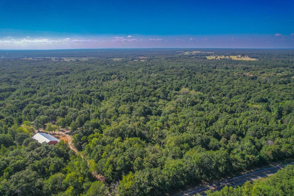 If you’ve been looking for a great recreation property in a good area, then you have to check this one out! It’s a rare opportunity to have lots of Kickapoo Creek Bottoms and some high ground with nice improvements for fun weekend stays with family and friends. The property is full of trails giving you access to all parts and multiple different hunting setups. Kickapoo Creek is known to be teeming with wildlife including whitetail deer, wild hogs, waterfowl, and more! There is a 50x100 metal building ready to be finished out into a great barndominium that is already rough plumbed for a bathroom with electric in place. Currently, the owners park a camper inside for weekend trips, leaving plentiful room for storage and hanging out inside. For casual weekends, the property is close to World Famous First Mondays in Canton making it a great year-round property for the whole family. Properties along Kickapoo Creek don’t come available often, call today to set up your own private showing!