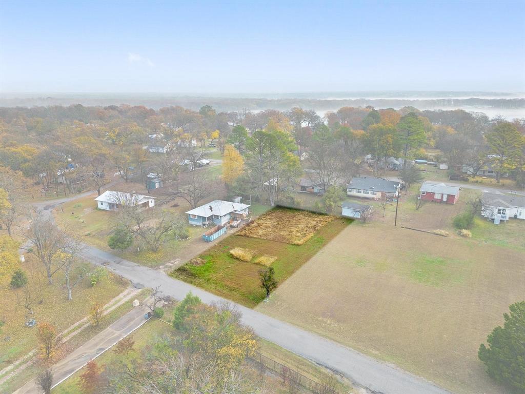 Imagine building your dream home with a lake view. This lot is ready for your plans to build just that. This lot is located
within walking distance to Lake Tawakoni, down the street from City Hall and a park with boat ramp access. Come
check it out!