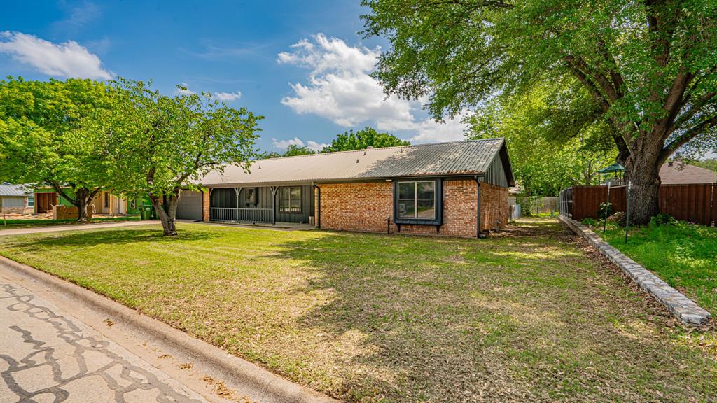 This one is a true gem! Located in the heart of Glen Rose just off Highway 67 and minutes from Glen Rose schools, shopping, and everything this beautiful and charming town has to offer! Quarter acre interior lot, No HOA, City water, and City sewer. Brand new HVAC December 2025. New flooring and paint August 2025. New lavatories September 2025. No carpet! Metal roof, oversized 2 car garage measuring 20 foot wide X 28 foot long, large and inviting covered front porch, and a 35 foot long X 10 foot wide sun room off the back of the home. 3 bedrooms, 2 full baths, 1733 square feet, built in 1985, living room, separate breakfast area, kitchen, and aforementioned sun room. Living room features laminate flooring, brick wood burning fireplace, and ample room for your family. Breakfast area is just off the kitchen and living room looking out to the sunroom. Very functional kitchen with electric appliances including cook top stove, dishwasher, and disposal. Sunroom has plenty of room and windows to sit and relax while enjoying the views outside. Primary bedroom features large beautiful windows for ample natural light and a convenient ensuite bath. Bedrooms 2 and 3 are large split bedrooms with walk in closets. Guest bath is conveniently located just off bedrooms 2 and 3. Utility room closet features ample room for the full size washer and dryer. Exterior features numerous large and mature trees, full sod front and back yard, covered front porch, and a covered back patio. This home is priced to sell quickly. Homes like this at this price don't come up very often. Make this your perfect home!