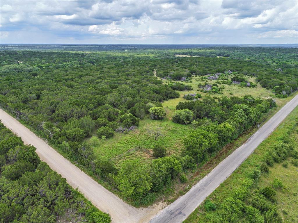 Peaceful versatility defines this 388 acre recreational dream property approximately 10 minutes out of Stephenville.  Located on a paved road, this property has has a ton of road frontage and absolutely great cover to attract wildlife with water to attract. Older 1800 sq ft abandoned home, several out structures, and roads throughout await you. Properties like this don't come along very often, don't hesitate and miss your chance at the dream.