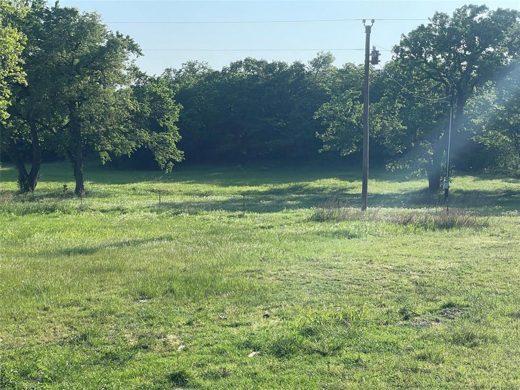 Great investment property, possible RV Park, lots of county road frontage, trees, wildlife, creek, grass.  Property does have a DW home with shop, singlewide that need a little TLC, barn, corrals.  Hurry to schedule a viewing of this property.