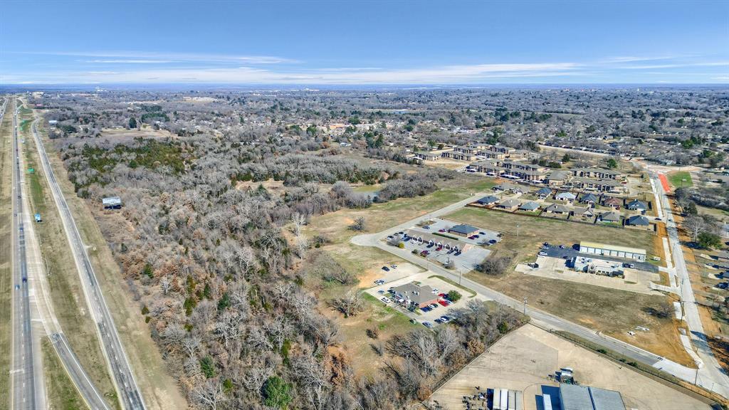 UNBELIEVABLE LOCATION BUSINESS LOT.  Zoning is Commercial land.   Located 4 minutes off busy Hwy 75 in Denison TX.   City of Denison requires lots of 1 ac and larger to have RETENSION PONDS located on site.   Lot has retention pond located on back of lot  to ensure proper drainage.    LOCATION  LOCATION  LOCATION...   Location is the Key to A Great Business..   Lot is 1.235 acres with utilities available at the street.  Popular restaurant is right around corner from this location.     Sherman and Denison is now  the new hotspot for real estate commercial opportunities. Many business companies are making this their new home base.   This commercial lot is located on corridor to Oklahoma and the Dallas, Ft Worth metroplex and South Texas. Check out this investment opportunity today.