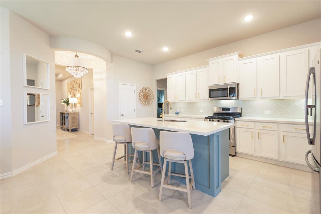 Rare 5 bedroom 3 bath single story home in ANNA Ranch with new roof and walking distance to both elementary and middle schools. Built in 2022, this beautifully maintained home offers one of the most desirable floorplans in the neighborhood with five true bedrooms, and open concept design, and abundant natural light throughout. The spacious kitchen features quartz countertops, stainless appliances, oversized island, upgraded hardware, abundant cabinetry and a HUGE walk in pantry-all opening seamlessly into the living and dining areas for easy entertaining and everyday living. The private primary suite includes dual sinks, soaking tub, separate shower, and a large walk in closet. Upgraded lighting! Step outside to enjoy the covered back patio and peaceful fenced backyard- perfect for relaxing evenings, pets or family gatherings. Recent major upgrade includes new roof, offering added value and  peace of mind. Anna Ranch has a community pool, playgrounds, nearby schools and quick access to HWY 75 for an easy commute.