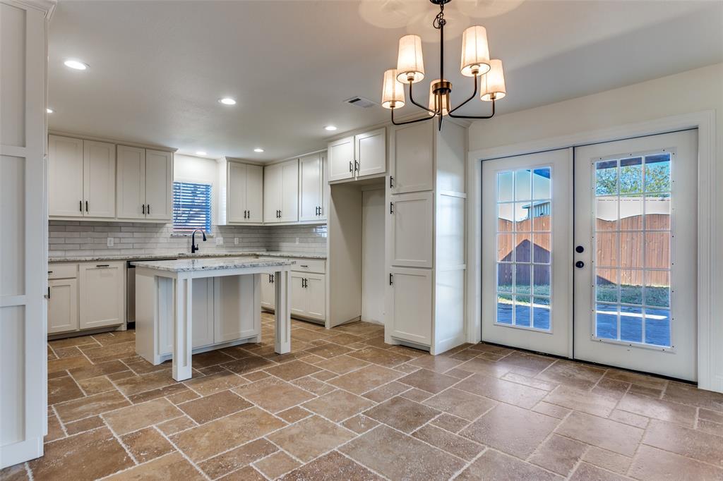 NEW PRICE, REDUCED FOR OPEN HOUSE. MOTIVATED SELLER. Welcome to this beautifully remodeled and updated 3 bedroom, 3 full bath home offering 2,072 sq ft of bright, open living space on just over an acre. The spacious living room features abundant windows and an expansive brick fireplace with a long hearth, creating a warm and inviting atmosphere. A large dining room provides plenty of space for gatherings and entertaining. The updated kitchen includes all new appliances, adding modern convenience to the home. Outdoor living is exceptional with a covered porch and a 30 × 15 patio with a pergola, perfect for relaxing or hosting guests. The oversized detached garage is wired with 220V, ideal for welding, woodworking, or personal projects. Located in the desirable Indian Harbor community, residents enjoy 24-7 gated access with a manned and monitored guard shack, a clubhouse, community pool, playground, and a marina with access to Lake Granbury. A nearby grocery store and café add to the convenience.This well-appointed property offers privacy, space, and fantastic community amenities—ready for its next owners to enjoy.