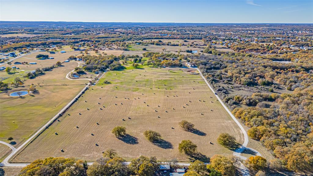 AG Exempt, Unincorporated land! Current annual real estate taxes are $34 a year! You heard me......

Enjoy this incredible opportunity to own your own beautiful piece of Texas! This expansive 22.8-acre tract in Azle, TX has been thoughtfully divided from the original parent tract and is now ready for its next visionary owner. Located within the highly regarded Azle ISD, this land offers the perfect balance of convenience and seclusion—just minutes from shopping, dining, and everyday essentials, yet completely removed from the hustle and bustle of city life.

As you enter the property, you’ll immediately feel the privacy, peace, and wide-open tranquility that make this area so special. The land is flat, buildable, and entirely usable—no floodplain, no HOA, and no known restrictions—giving you unparalleled freedom to create whatever you envision. Whether you dream of building a custom estate, multi-home compound, or family ranch, this property offers limitless potential. 

Every evening, enjoy the breathtaking Texas sunsets that stretch across the horizon, painting the sky in unforgettable colors as you unwind in your own private retreat. The peaceful surroundings and natural beauty make this an extraordinary setting for anyone seeking space, serenity, and the freedom to design their land to fit their lifestyle.

No flood plain. No HOA. No restrictions. Just pure Texas land—ready and waiting for its new owner. Opportunities like this rarely come along in such a desirable location. Come experience the sunsets, the space, and the potential for yourself!