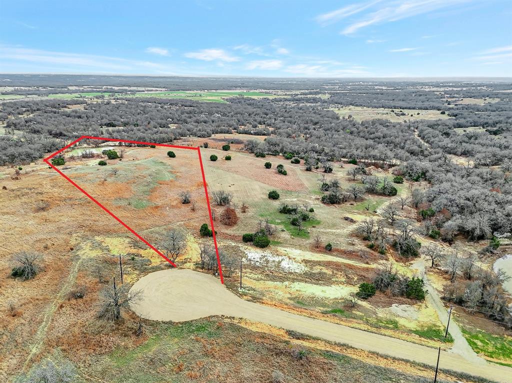 Scenic 5.57-acre homesite located in Stallion Meadows Estates Phase Two in Perrin, Parker County. This beautiful property features gently rolling terrain, open pasture, native grasses, and scattered trees that create a peaceful North Texas setting.
The natural elevation across the property offers several potential building sites where you can design your custom home and enjoy wide countryside views and beautiful Texas sunsets. The land provides a great balance of open space and tree coverage, offering both privacy and usable acreage.
A small stock tank located toward the back of the property area adds to the natural character of the landscape and enhances the peaceful rural surroundings. The rolling topography and wide-open space make this property ideal for a custom home, barndominium, or private country retreat.
Located in a quiet rural subdivision with acreage homesites, this property offers the charm of country living while still being within driving distance of nearby towns and amenities.
Buyer and buyer’s agent to verify availability of utilities, restrictions, and schools. Boundary Lines are approximate.