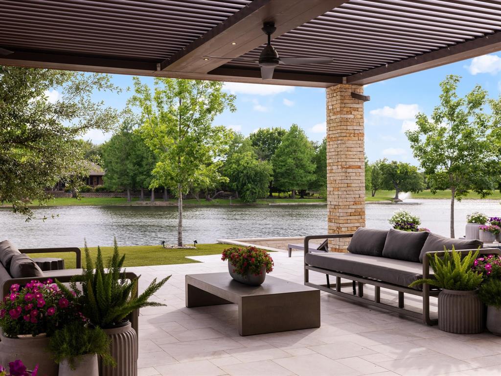 Rare half acre waterfront home in prestigious Willow Bend Lakes. 2017 newer construction recently upgraded floor to ceiling. Dazzling water views as you step through your front door. Experience resort style living in your own backyard- $250k commercial louvre system opens & closes with one button, spanning 2,000 sq ft of covered outdoor area. Outdoor kitchen, pool & spa, sunken firepit, heaters, & fully turfed yard exemplify indoor outdoor living. Imagine fishing at sunset from your own backyard! Custom iron glass windows & doors showcase water views of ducks, geese, & swans - constantly changing living art. Kitchen & hidden pantry feature four ovens, gas cooktop, two 48” fridges, & two dishwashers. Custom cabinets, wine room, wide plank oak flooring, designer light fixtures. Latest security technology, cameras, sound system, media room, & Tesla charger in 3 car garage with automatic gate. 2 story master bedroom with balcony – this property is a unicorn that you must see for yourself!