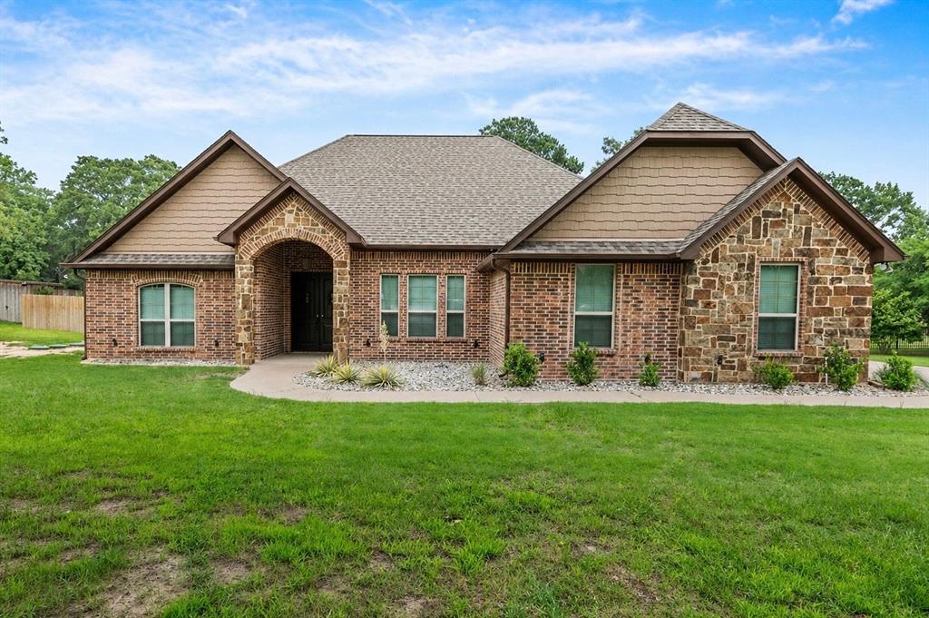New and improved, with brand new septic system and privacy fence! Looking for a mix of luxury and out of city limits? Located conveniently in the greystone subdivision, this 4-bedroom, 2-bathroom home has been freshly updated with new fixtures, sinks, toilets, faucets, irrigation system, garage door and more. With stylish and sleek light fixtures, luxury flooring, high ceilings and arch ways, updated new kitchen appliances, this home has so much to offer. This home offers an open floor plan for a large entertainment space and a separate formal dining area for all your hosting needs, along with custom crown molding and craftsman trim to really highlight the details. All new interior and exterior paint with no shortcuts in curb appeal with fresh rock and easy to maintain plants.  Call for your showing today!