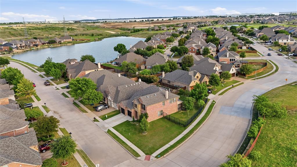 MOTIVATED SELLER for this beautiful Drees home offering approximately 3,256 sq. ft in the highly sought after Seventeen Lakes community & in the top notch Northwest ISD is ready for you to call home. Situated on a large corner lot, nice size backyard with two apple trees, pear & grape trees this four bedroom, three full bath and half bath showcases beautiful wood floors and an open layout. Step out your front door and walk a few steps to a gorgeous lake to take in sunrises or sunsets as well as catch glimpse of nature throughout the seasons. The eat in kitchen w stunning granite countertops, a center island, and a custom wine bar, all flowing into the family living room which is perfect for entertaining. A stone fireplace with a cedar mantle adds warmth and character. The downstairs primary suite features a bay window sitting area, a spacious bathroom with separate vanities, separate shower, jetted tub, and a walk in closet. Upstairs offers three additional bedrooms, including one with an ensuite bath, along with a game room and or flex room. Residents enjoy a golf cart friendly community with two pools, two playgrounds, splash pad, baby wading pool, BBQ grills, multiple catch and release fishing lakes, and walking biking trails that meander around the lakes.  Conveniently located near DFW airport, Charles Schwab, Fidelity, shopping, dining, golf courses, and more. Don't let this one slip away. Schedule your tour today, and let's write up your offer and make this your home.