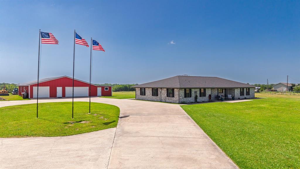 Welcome home to nearly 7 Acres of AG exempt land with an exceptionally maintained home and an incredible 3,500 SF Shop. If you’ve been searching for a property that truly has it all, this is it. Set on scenic pastureland, this property offers the perfect balance of peaceful country living and everyday convenience. The 2,500 sq ft home features an open-concept design ideal for entertaining, with a spacious living area flowing into a kitchen centered around a large island—perfect for gatherings, holidays, and daily life. It includes three generously sized bedrooms, 2½ bathrooms, and a dedicated office. Enjoy quiet mornings on the front porch with sunrise views, and unwind in the evenings on the covered back patio with TV and speakers, overlooking the expansive backyard and capturing stunning sunsets. A major highlight is the oversized shop totaling 3,384 square feet which offers 5 different work and storage areas. One of your favorite features will be the dumb waiter and stairway to second story storage area which hosts 450 ft of additional storage, perfect for all your seasonal decor. Some of the additional features include LED lights, 12 ft high bay and 11 ft 6 inch overhead door. The walls are cladded in OSB and walls and ceilings are both insulated. 220 volt outlet for stand up air compressor, multiple electric outlets on each wall, many on their own separate circuits, 2 work benches, high efficiency windows and multiple doors. It truly has exceptional flexibility for business, hobbies, storage, or serious projects—fully equipped to support a wide range of uses. Surrounded by open pasture and tranquil countryside, this property delivers true rural living without compromise. Rarely does a property combine acreage, a thoughtfully designed home, and a shop of this caliber. Schedule your private showing today!