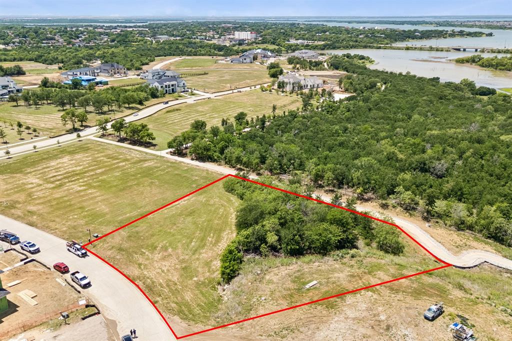 A rare opportunity to design and build an extraordinary custom estate on a sprawling 1.12-acre flat homesite within the prestigious gated community of The Hills of Kingswood. This private lot backs to the community trail and offers one of the largest and private opportunities to build. Nestled among some of the area’s most impressive luxury residences, this premier lot is surrounded by stunning Mediterranean, Modern, French, and Traditional-inspired estates in one of Frisco’s most exclusive and architecturally distinguished communities. Offering ample space to create the ultimate private retreat, this expansive homesite would easily accommodates an outdoor oasis complete with a resort-style pool, sprawling entertaining areas, sports court, guest retreat, detached casita, lush gardens, or additional garage space, the possibilities are truly endless. Residents enjoy 24-hour guarded security, exceptional privacy, and an elevated lifestyle within this ultra-luxury enclave. Ideally positioned with convenient access to the Dallas North Tollway and Highway 121, and just moments from The Star and Legacy West, this remarkable property offers the perfect blend of sophistication, exclusivity, and premier location. Plus, just minutes away from Lewisville Lake, residents can enjoy endless weekend recreation including boating, paddleboarding, fishing, waterfront dining, and unforgettable sunsets on the water, bringing resort-style living full circle.