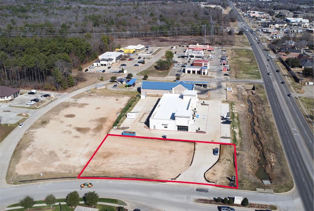 Drive-Thru Ready Pad Site in South Tyler. Pad site is located at the northwest corner of Old Jacksonville Hwy and Elkton Trail.  Ideal for a drive-thru restaurant concept or retail development. Shown as Building B on the included site plan. 
Approx. 0.67 acre pad site. 
Can accommodate an approx. 2,000sf building with a drive-thru. 
Adjacent retail center is fully leased. 
Near current and future retail or office or medial developments. 
All utilities and Light Commercial (C-1) Zoning are in place. 
Multiple pad sites available.