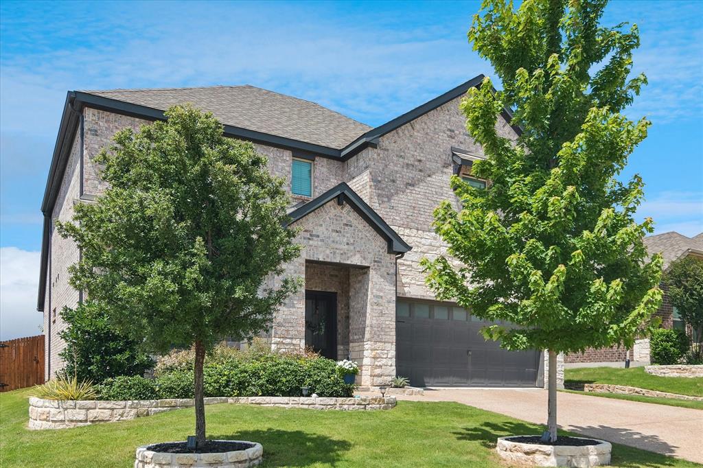 Discover this Melissa area home featuring a classic stone and brick exterior and a beautifully landscaped yard. Inside, you'll find wood-look luxury vinyl plank flooring and an island kitchen with a double oven that overlooks a spacious family room. The property includes a versatile study or flex room complete with a sliding barn door. The primary suite is conveniently located on the main level, while secondary bedrooms and a game room are situated upstairs. Additional highlights include an oversized laundry room, a mud room, foam-encapsulated insulation for outstanding energy efficiency and a fenced rear yard with a covered patio. Enjoy the scenic neighborhood walking trail and easy access to I-75, HEB, Buc-ee's, and more. Priced to sell!