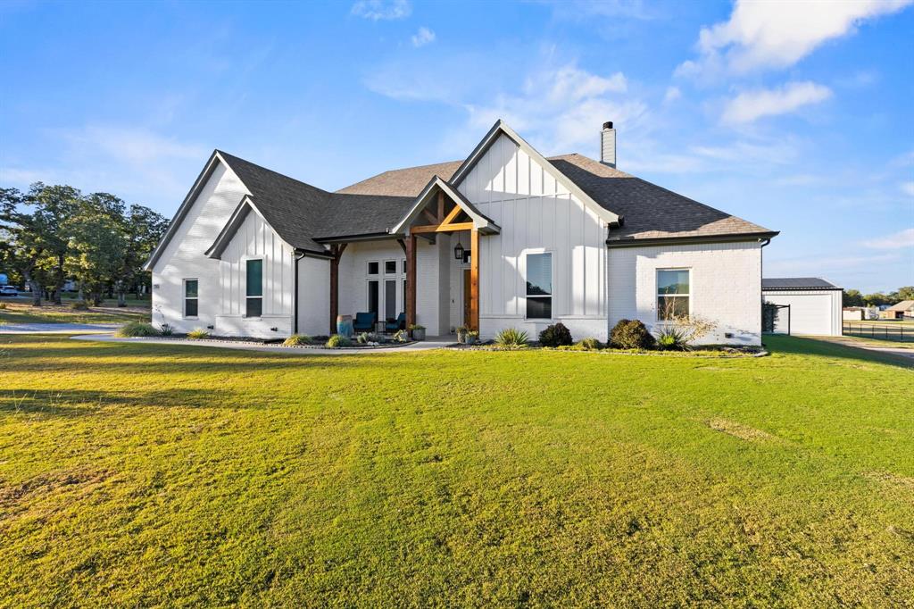 One-of-a-kind estate offering multi-generational living on 2 beautifully treed acres. Advertised square footage includes both the main residence (2,644 sqft) and the separate ADU (1,085 sqft). Designed with versatility, efficiency, and comfort in mind, this thoughtfully planned property features a spacious main home, a fully separate barndo-style ADU, shop and RV parking, and resort-style outdoor living. The main residence offers 4 bedrooms, 3 bathrooms, a private office, and a second living area, providing flexible space for family life, working from home, or entertaining. The open-concept design is anchored by a well-appointed kitchen featuring a gas cooktop, ample counter space, and seamless flow into the living and dining areas. The primary suite is generously sized and includes a large walk-in closet and spa-inspired bath. Step outside to an exceptional outdoor living space with a large covered patio and fireplace overlooking the in-ground pool. A dedicated pool house, fire pit, and mature trees create a private, inviting atmosphere ideal for year-round enjoyment. The property is exceptionally improved with a 40x50 insulated shop, a 14x50 covered RV parking area, and an additional 14x40 covered concrete space—offering abundant room for vehicles, equipment, hobbies, or business use. A standout feature is the fully separate 30x50 barndominium ADU, totaling approximately 1,500 sqft including the garage, with 1,085 sqft of heated living space. This residence includes 2 bedrooms and 2 bathrooms, its own private driveway, and a separate county-assigned address with its own mailbox—ideal for extended family, guests, or hosting while maintaining privacy from the main home. Additional highlights include owned solar panels, multiple driveways for ease of access, and thoughtful site planning that balances privacy with functionality. TXT RODEO6 to 88000 for a full video, more photos, and deed restrictions.