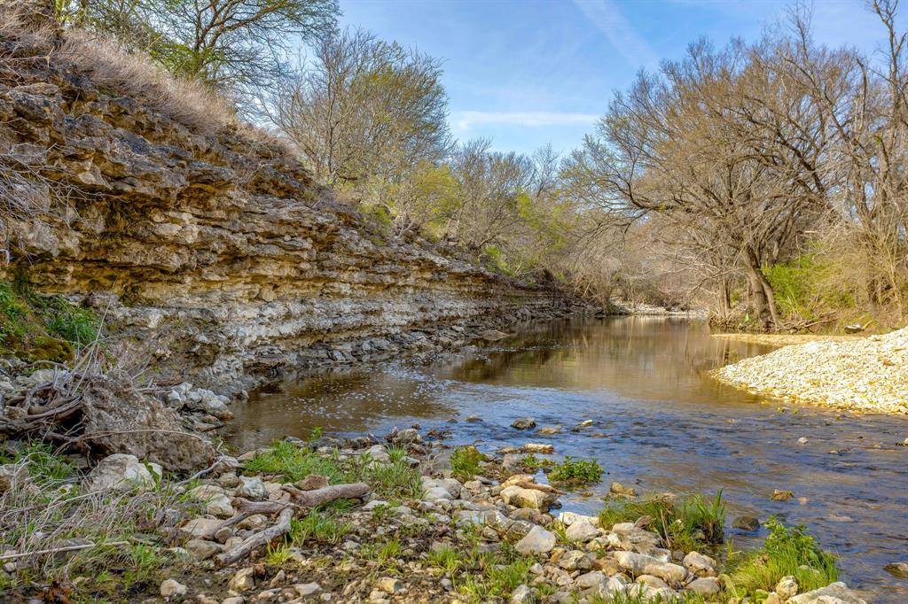 This exceptional ±135-acre ranch on the Nolan River in Blum, TX offers a beautiful mix of rolling terrain, usable open pasture, and heavily wooded areas filled with native hardwoods. Running through the middle of the ranch is the scenic Nolan River, creating a peaceful setting with excellent wildlife habitat and recreational appeal. A network of established trails makes navigating the property easy by foot, horseback, or ATV.  Currently utilized for hunting and outdoor recreation, this versatile ranch presents outstanding potential for a private retreat, working ranch, homesite, hunting property, or future investment. An additional ±10 acres is available for purchase to expand river frontage and enjoyment.