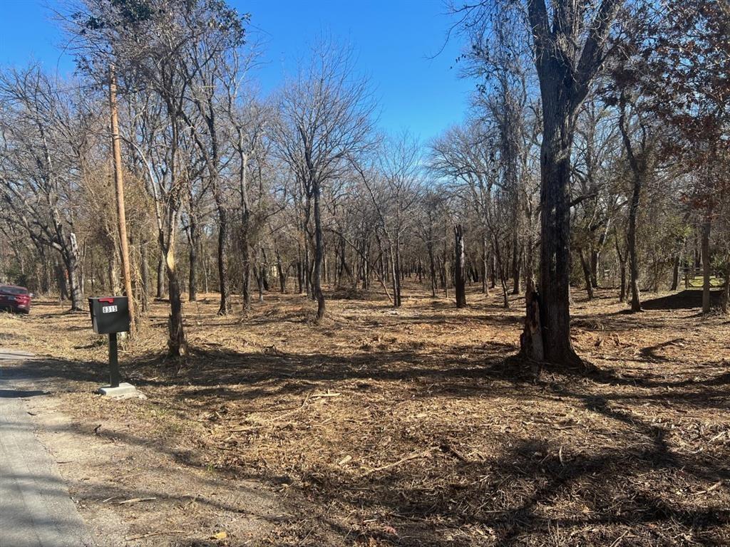 1.16-acre homesite near Eagle Mountain Lake with utilities available and lake access easement in place. The property features a natural dry bed that adds privacy and character while still offering plenty of usable space to build a custom home. Located in a desirable area of Fort Worth with easy access to the lake, shopping, and major roads. A rare opportunity to own over an acre close to Eagle Mountain Lake. The property also includes an older single-wide mobile home with a clean title, updated electrical and plumbing, and most interior materials still inside. A buyer could choose to remove it or potentially resell it for approximately $6,000–$10,000.This land offers excellent space and utility access for anyone looking to build or create income-producing opportunities.

The land benefits from a shared Lake Easement used by approximately 18 surrounding parcels. This private lake access point is secured behind a locked gate and is located less than a quarter mile down the road from the property

*** SELLERS DISCLAIMER UPDATED 2026 10, MARCH REGARDING POSSIBLE EASEMENT ATTACHED & DRAINAGE INFORMATION- (Gully) 8290 eagle mountain circle IN TRANSACTION DESK***