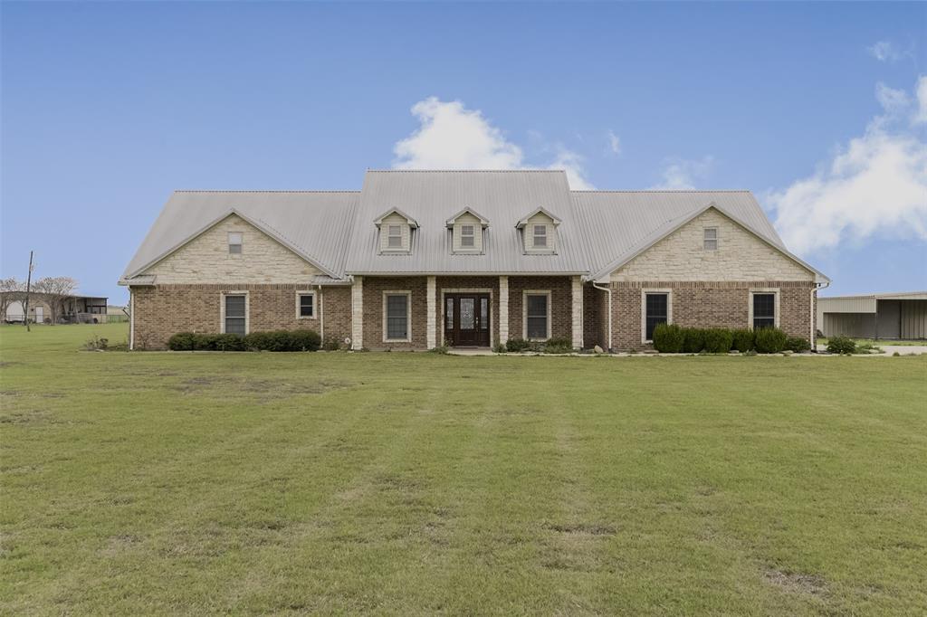 If you’ve been searching for a custom home on 10+ acres in Waxahachie, 1066 West Road offers the space and freedom that’s getting harder to find. Set in a peaceful rural setting in Ellis County, this property gives you room to live, work, and spread out—whether that means animals, projects, or simply enjoying wide-open land. Inside, the kitchen is designed to be used and enjoyed, featuring a gas range, double ovens, and generous workspace that makes cooking and gathering feel natural. The home’s layout creates separation when you want it and connection when you need it. The primary suite includes a private sitting area, offering a quiet place to unwind at the end of the day. Thoughtful features like a storm cellar provide peace of mind, while the detached carport and additional storage give you practical space for equipment, tools, or everyday needs. Outside, the 10+acre property truly shines—offering flexibility for animals, gardening, recreation, or future improvements. This is ideal for buyers looking for land in Waxahachie TX with a home already in place. While the setting feels private and rural, you’re still conveniently located near shopping, dining, schools, healthcare, and major highways, making commuting to Dallas-Fort Worth manageable. If you’re looking for a home with acreage in Waxahachie, a custom home with land, and a true Texas country lifestyle, 1066 West Road delivers!