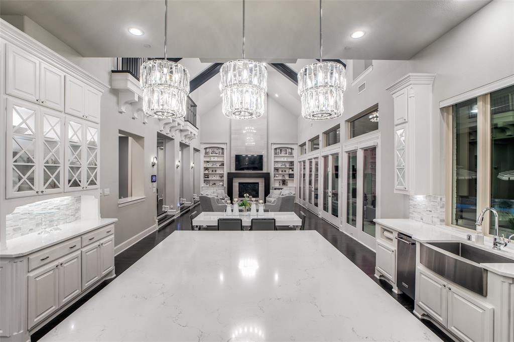 Gorgeous custom designed home in highly sought after Whitley Place, has desirable features one would expect, no detail was left out. Situated on a quiet cul-de-sac this 5501 sqft home welcomes you in with a grand double empire staircase and glass enclosed wine room and bar. Elegant architectural designs are featured throughout the home from the soaring ceilings to the multi-levels. A serene chef’s kitchen with ample cabinet space is unmatched. A luxurious primary suite, steam shower, work-out, sitting area. Office, play room, game room, media, craft room, hidden safe room.  Every inch was designed to maximize storage space. Expansive wall of windows transcends you to the spectacular resort-style backyard featuring a tranquil pool, spa, water slide, heated cabana. The tree lined property offers privacy to the multiple patios and 3 different firepit seating areas. Kids will love the custom turf area with a mini go kart track, and gated entrance. 5 car garage for the car enthusiast!