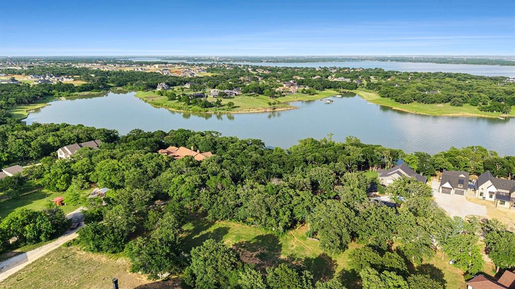 Tucked inside the gated lakefront community of Braewood Bay, this rare one-acre homesite offers the kind of setting that is increasingly difficult to find near Lake Lewisville. Positioned on a quiet cul-de-sac among custom estate homes, the lot pairs privacy, mature trees, and peaceful water views with the structure of a deed-restricted neighborhood designed to protect the character of the community.

The setting feels secluded without being remote, with quick access to Little Elm, Frisco, Denton, and the Lake Lewisville Toll Bridge. Braewood Bay offers a quiet lakeside atmosphere with community access to the shoreline, beach, and jetty, creating an ideal backdrop for a custom residence designed around outdoor living, sunset views, and the natural beauty of the lake.

For buyers who have been waiting for a true custom-build setting near the lake, this is the kind of lot that rarely becomes available: private, scenic, protected by surrounding estate homes, and close enough to the water to shape the entire feel of the future residence. Buyers should verify building requirements, restrictions, utilities, floodplain considerations, and lake access.