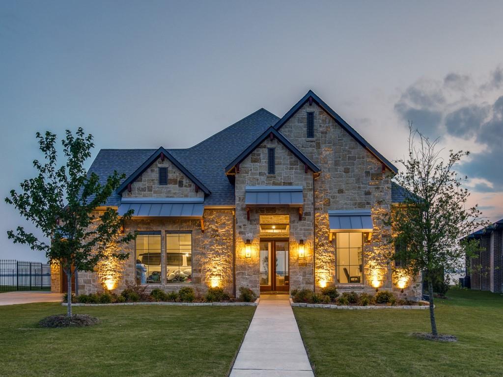 Located in the prestigious Heath Golf and Yacht Club and MMD PAID IN FULL - NO YEARLY ASSESSMENTS! Lakefront views greet you as you enter this stunning custom home! Just steps from the water with 150 feet of shoreline. Dock being built! Luxurious one-story home with a spacious floor plan designed for entertaining with living area at the heart of the home, flanked on one side by a dramatic fireplace and the chef inspired kitchen on the other. This stunning home features 4 bedrooms, each with its own en-suite bath and an additional 2 half baths. The floor to ceiling windows in the living area, master bedroom, secondary master, and flex space game room offer panoramic views of the lake.  Perfect outdoor living and entertaining with the well equipped outdoor living space and kitchen, complete with custom ventilation!  LOTS of after purchase UPGRADES motorized blinds inside and out, Culligan system, home generator, lighting, outdoor kitchen, fence and more! Social membership is $125 mo.