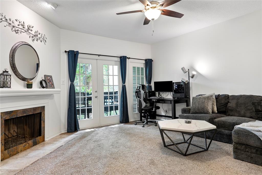 Welcome to your serene retreat in a quiet, well-maintained condo community! Ideally situated on a corner of the building, this inviting 2-story condo backs to the property's wooded area, offering an extra layer of privacy with no neighbors directly in view and a peaceful, tree-lined backdrop. The layout is perfect for both relaxation and entertaining. The first floor features a spacious living area with a cozy fireplace, a dining space, and a well-equipped kitchen, all flowing seamlessly to a private balcony overlooking the wooded scenery. A convenient half bath is also located on the first floor. Upstairs, you'll find two generously sized bedrooms, each offering privacy and comfort. The second bedroom even has its own private entrance, making it an excellent option for roommates. The two full bathrooms upstairs ensure ample space for everyone. Newly installed AC unit in 2023, keeping your home comfortable year-round. With a prime corner location close to an array of shopping and dining options, this condo is a fantastic find. Don't miss out on the opportunity to make it yours!