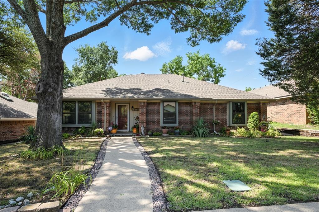 Single-story East Dallas home in Eastwood Hills. 3 bedrooms, 2 bathrooms, flex room, 1953 sq ft. No HOA.  This one-owner brick home on Sweetwater Drive has a large living room with gas fireplace, a separate dining room, breakfast nook, dedicated laundry room, and a flex room off the living room with backyard access, adaptable to a home office, guest room, studio, or whatever fits your lifestyle. The kitchen has granite countertops, a pantry, gas range, and all appliances are included.  Hardwood, marble tile, and clay tile throughout, no carpet. Interior details include skylights, a  built-in coffee bar area, a double vanity in the primary suite and central vacuum system. The 2-car attached garage accesses from the rear alley for an uncluttered front yard and true curb appeal. Wood-fenced backyard with a mature shade tree and established flower beds. Plenty of room to make it your own. Minutes from White Rock Lake, the Dallas Arboretum, and the White Rock Trail system. Easy access to I-30, US-80, and LBJ Freeway. Grocery, dining and retail are all within a short drive. Built in 1983. One owner. Move-in ready. No HOA. Public utilities. Security system.