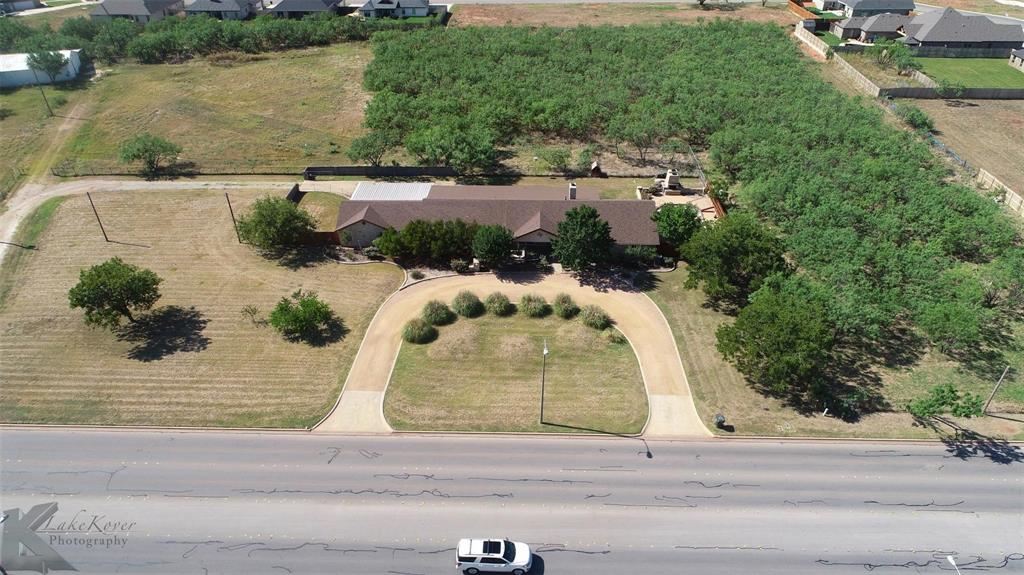 Prime opportunity for commercial development in a high-traffic, rapidly growing area! This 11.52-acre property sits directly across from the Fairway Oaks golf course community and just minutes from the hospital, medical plazas, schools, and restaurants. While rezoning would be required for specific commercial use, the location offers exceptional potential. The property includes a spring-fed tank covering nearly an acre, a large home, and a barn. The existing 4-bedroom, 4-bathroom home with 3 living areas offers ample space and versatility, making it ideal as a rental for shared tenants, with plenty of room for RV or equipment parking.  A rare find combining location, space, and future development potential.
