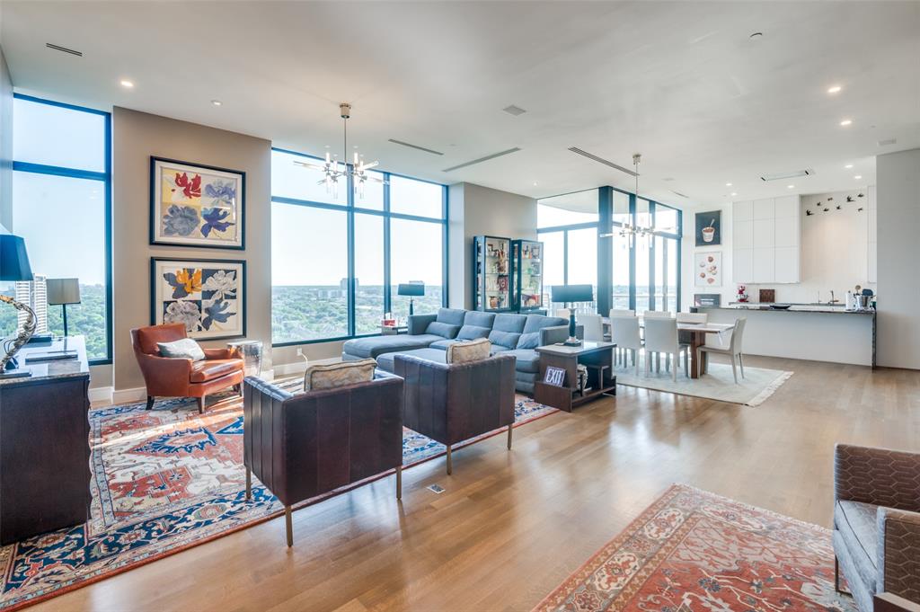 One of a kind totally renovated & reimagined Claridge Penthouse. Double door Entry leads to an impressive open Living, Dining, Kitchen & Bar made especially for entertaining. The finest features include solid white oak rift & quarter sawn floors, 11.5 ft ceilings, marble Baths, Toto toilets, designer chandeliers, 2 full-size wine refrigerators in the Bar & unobstructed views of Turtle Creek Park land, Kalita Humphreys Theater & Katy Trail. The fabulous Chef's Kitchen is outfitted with German cabinets to the ceiling, natural durable quartzite waterfall counters, Gaggenau appliances including extra-large refrigerator-freezer, double ovens, induction cooktop with gas available, and marble backsplash adorned with New Ravana Birds. The Laundry room has a 2nd dishwasher & sink. The spa-like marble Master Bath boasts an extra-long & deep double vanity, Italian lighting, Dornbracht fixtures, walk-in shower, free-standing tub & a 23 ft long closet. Extra large storage & first level parking.