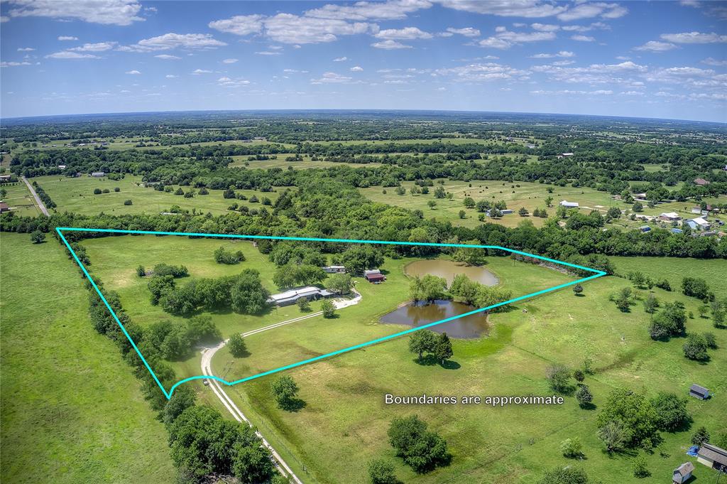 Discover the beauty and potential of this stunning 10.147-acre property located within Bland ISD. This unique tract offers a perfect blend of partially wooded areas and open grassy spaces, making it ideal for those seeking both privacy and natural charm.

The property features an equipment building and two existing ponds, adding both functionality and scenic value. There are also two older mobile homes on-site; however, the seller is not currently providing access to them.

For outdoor enthusiasts, the Northeast Texas Trail and Chaparral Bike Trail run along the western boundary of the property. Stretching from Farmersville to Celeste, these trails provide excellent opportunities for biking, walking, and enjoying nature right at your doorstep.

Utilities are already in place, including electric, water, propane, and a septic system—making this an excellent choice for building your dream home. Whether you envision a custom home, barndominium, or mobile home, this property is ready to accommodate your plans.

Access is via a private gravel road off FM 2194, which leads directly to this secluded retreat. Maintenance of the road is shared among neighboring property owners, who split the cost of re-rocking as needed.

If you’re looking for peaceful country living with convenient access and outdoor recreation nearby, this property is a must-see.