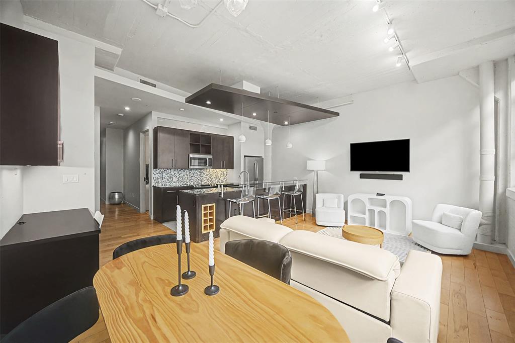 ***BUYER BONUS***SELLER WILL PRE-PAY 3 MONTHS HOA DUES***

Discover an unparalleled opportunity to reside in the prestigious Historic Montgomery Plaza, Fort Worth's iconic landmark of refined urban luxury. This exquisite West Tower residence features 2 generously appointed bedrooms, 2 full baths, and 2 deeded parking spaces (#2179 & #2180) for ultimate convenience. Enjoy a sophisticated open floor plan with split bedrooms, rich hardwood and tile flooring, premium stainless steel appliances, in-unit washer & dryer, expansive walk-in closets, and abundant storage—blending spaciousness with elegance.

Positioned on the 5th floor of this distinguished 1928 Art Deco conversion, the home offers timeless charm and modern luxury.
Experience a resort-inspired lifestyle with 24-hour concierge service and Texas's largest rooftop pool deck—nearly an acre of unparalleled elegance. Relax in six private cabanas, by the stunning infinity-edge pool with water features and separate spa, around five fire pits, or in two sophisticated outdoor living areas with plush seating, gas grills, and dining spaces.

Exclusive amenities include a refined owners' lounge for events, a premier 14-seat theater, and a newly renovated state-of-the-art fitness center.
Just minutes from vibrant downtown Fort Worth, Sundance Square, and the premier entertainment cultural districts, with easy access via daily public transit and the DASH.

Move-in ready—this is more than a residence; it’s an exclusive lifestyle of timeless elegance and modern opulence in the heart of Fort Worth.