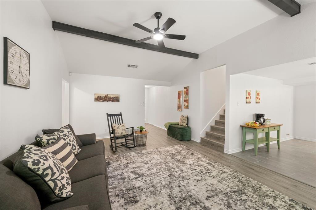 Not every five-bedroom home feels this inviting. From the moment you walk through the front door, soaring ceilings & dramatic architectural beams create a sense of openness rarely found in this price range. Sunlight pours into the spacious living room where the brick fireplace naturally becomes the heart of the home, creating the perfect place to gather & unwind after a long day. The completely updated kitchen blends timeless style with everyday functionality. Crisp white cabinetry, granite countertops, stainless steel appliances, updated hardware & generous counter space make meal prep effortless while remaining connected to the dining area & living room. Whether you’re hosting holiday dinners or helping with homework around the  table, this home was designed for real life. One of the biggest advantages of this floorplan is flexibility. With five true bedrooms & 3 full baths, the home easily adapts to changing needs. Create dedicated offices, guest rooms, playrooms, hobby spaces or private living quarters without sacrificing bedrooms. Upstairs offers a retreat that feels almost like a second home. The oversized bonus living area creates endless possibilities. Outside, mature shade trees provide beauty & relief from the Texas summer while the backyard offers plenty of room for pets, kids, gardening or entertaining. Burleson ISD with convenient access to shopping, restaurants, highways & everyday conveniences, this home delivers the rare combination of space, updates & affordability that today’s buyers are struggling to find. If you’ve been searching for room to grow don’t stretch your budget, this home deserves a place at the top of your showing list! Seller to provide a 1-0 temporary rate buydown with use of seller's preferred lender. Lower your payment from day one. Contact listing agent for program details and lender information.