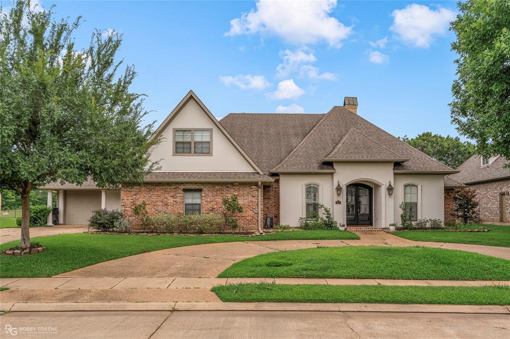 Nestled on the 4th fairway of the Stonebridge golf course, this updated and upgraded 5-bedroom, 4.5-bathroom home is sure to impress! The front circle drive and mature landscaping offer immediate curb appeal as you arrive. Inside, the attention to detail throughout is evident and the open and airy floorplan is sure to be an entertainer's dream. The spacious living room features floor-to-ceiling windows overlooking the golf course, a cozy fireplace, and ornate molding to give the space an elevated feel. Flowing from the living room is the modern kitchen, breakfast nook, and hearth room with its own fireplace. Whether you're hosting a dinner party or simply having a quiet weeknight meal, the upgraded appliances, sleek counters, and custom cabinets are sure to make it a breeze. Additionally, the separate formal dining room offers even more options for hosting. The remote primary suite will be the perfect space to unwind after a long day with its spa-like ensuite bath boasting a floating vanity with dual sinks, a custom tiled shower, and luxurious soaking tub. The three additional bedrooms downstairs each have an updated ensuite bath, offering privacy and convenience for guests and family. Upstairs, the oversized 5th bedroom offers the flexibility to be used as a bedroom, a game room, or dedicated office space, whatever suits your unique needs. A media room and 4th full bathroom complete the second floor. Outside, the extended back patio gives you plenty of room to host summer BBQs or just enjoy time outdoors. With an expansive backyard, you have the option to install a pool, a firepit, or create a garden! Community amenities include the golf course, a clubhouse, a pool, and tennis courts plus a guarded entrance. This home just might be your next dream home - schedule your private tour today and envision the possibilities!