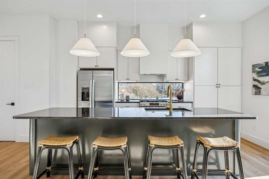 Welcome to 2151 Mail Avenue, a brand-new collection of modern three-story condos designed with both style and functionality in mind. This new construction 5 unit condo community offering a great opportunity to own an income producing asset in a growing Dallas market. The first level features a versatile flex room with a closet, perfect for a home office, lounge, or guest space. The second floor opens to an expansive living area filled with natural light, highlighted by high ceilings and a seamless open-concept layout. The kitchen serves as the centerpiece of the home, featuring custom cabinetry, an oversized island, and access to a private balcony—ideal for both entertaining and everyday living. The third floor features the home’s bedrooms, including the spacious primary suite with a double vanity, walk-in closet, and oversized walk-in shower. Thoughtful design, modern finishes, and a well-planned layout come together to create a comfortable and stylish home in Dallas. 2147 Mail Avenue and 2151 Mail Avenue may be acquired together, delivering a 10-unit portfolio with increased cash flow and stronger return potential.