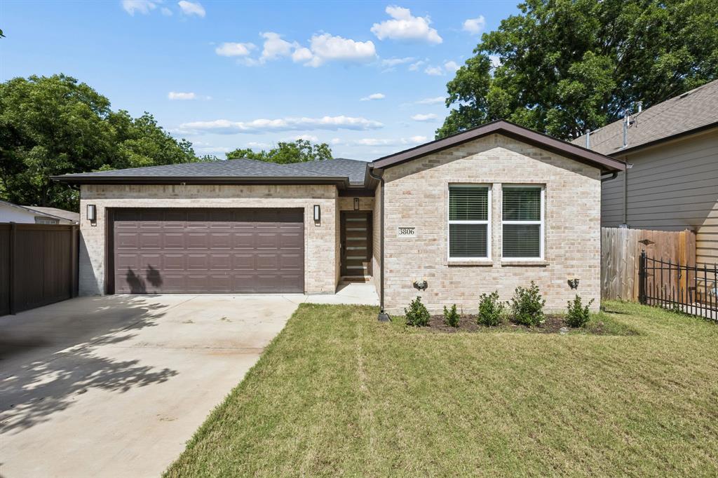 Modern design, thoughtful craftsmanship, and an open-concept layout come together in this beautifully finished, like-new 4-bedroom, 3-bathroom home just minutes from the heart of Dallas. From the custom feature wall surrounding the electric fireplace to the spa-inspired primary suite, every space has been designed with both style and comfort in mind. Step inside to a light-filled living area where wide-plank flooring, decorative lighting, and top-tier finishes create an inviting atmosphere. The living room serves as a true focal point, anchored by a striking geometric board-and-batten fireplace wall with built-in shelving that adds both character and functionality. The kitchen blends everyday practicality with elevated design. Custom cabinetry, quartz countertops, stainless steel appliances, and a spacious island provide plenty of room for meal prep, casual dining, and gathering with guests. Clean lines and carefully selected finishes give the space a polished, timeless feel. The primary suite offers a peaceful retreat with a board-and-batten accent wall, tray ceiling, generous natural light, and an impressive en-suite bathroom featuring designer tile, a freestanding soaking tub, an oversized walk-in shower, and an expansive walk-in closet with abundant storage. The attention to detail extends throughout the home, from the beautifully finished secondary bathrooms to the custom millwork and contemporary fixtures that create a cohesive look from room to room. Outside, the spacious backyard provides room to relax, entertain, garden, or simply enjoy a quiet evening under the covered patio. The fully fenced yard offers flexibility for a variety of outdoor activities while still being easy to maintain. Conveniently located near shopping, dining, entertainment, and major commuter routes, with downtown Dallas only 15 minutes away, this home delivers the space, finishes, and location that make everyday living feel just a little more enjoyable.