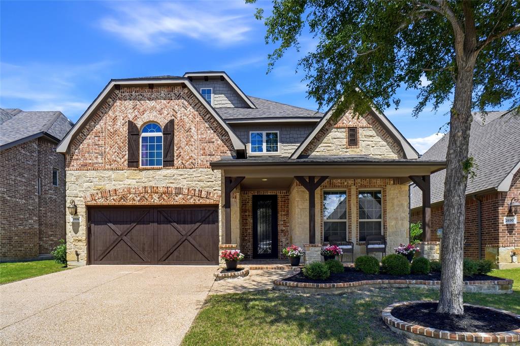Located in the highly sought-after Abbey Moor section of The Highlands at Trophy Club, this move-in ready 4-bedroom, 3.1-bath home offers exceptional curb appeal with its charming front porch and beautiful iron door. Inside, warm wood floors carry through much of the main level, connecting a private home office with French doors, an elegant formal dining room, and a bright open-concept living area. A wall of windows brings in abundant natural light, while the Austin stone fireplace with push-button start serves as a striking focal point. The generous kitchen is designed for both function and style, featuring a large center island, electric cooktop with the option to convert to gas, single-double oven, walk-in pantry, and double granite sink. The kitchen opens seamlessly to the living area, creating an ideal layout for everyday living and entertaining. The main-floor primary suite offers new carpet, a wall of windows, and a luxurious en-suite bath complete with dual vanities, a large soaking tub, separate shower with new frameless glass doors, and a spacious walk-in closet. Upstairs, a flexible game room and full bath sit adjacent to a private bedroom, making it a great space for guests or multigenerational living. Two additional bedrooms share a Jack-and-Jill bath with individual sinks and walk-in closets. Out back, the extended patio is set up for gatherings, featuring a built-in grill and a custom stone table with granite countertops. The two-car garage also includes convenient pull-down attic storage. All of this is nestled within the vibrant golf community of Trophy Club, where residents enjoy a community pool and splash pad, dog park, scenic trails, parks, Lake Grapevine, and top-rated Northwest ISD schools—just 15 minutes west of DFW Airport with easy access to major highways.
New roof and gutters installed May 2025.