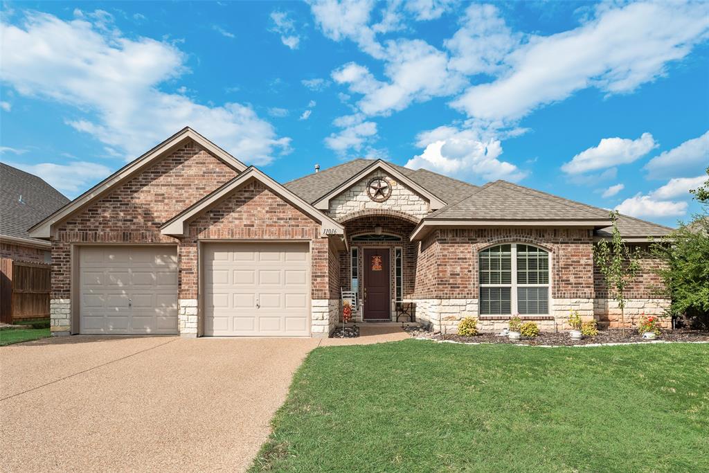 OPEN HOUSE !This beautifully maintained home in Silver Ridge addition is perfect for anyone who enjoys a quiet, mature neighborhood. With its own park and pond, plus lovely tree lined streets perfect for walking, it also has the convenience of shopping, restaurants, medical facilities, and much more just minutes away. This tucked away home is in a well-established neighborhood with spectacular long-range views! From the back of the house, you can see several miles across Lake Worth, Eagle Mountain Lake, and beyond.  Super-sized back porch is covered with an equally super-sized pergola to keep you in the shade on those hot Texas days. The large foyer welcomes you to the living room, dining room, kitchen and an accessible design with single level living. The kitchen boasts an abundance of storage space, including a walk-in pantry and an island full of drawers and beautiful custom cabinets. You'll love all the countertop space, gas oven & cooktop, the built-in microwave, trash compactor and the cozy breakfast nook.  The large primary bedroom on the main level has a lovely bay window and an en suite bathroom with two vanities, jet tub, walk in ceramic tile shower, toilet room, and spacious walk-in closet. Two more bedrooms on the main level share a Jack & Jill full bath, and a powder room is tucked off the foyer. The bonus room upstairs could become your media room, game room, workout room, hobby room, or a tucked away bedroom.  Off the spacious game room on the second floor is a large balcony where you can enjoy the sun and stunning views. Roof replaced Feb 2026. No MUD or PID. Come see 11016 Castle Oak Lane today and make it your Home Sweet Home !