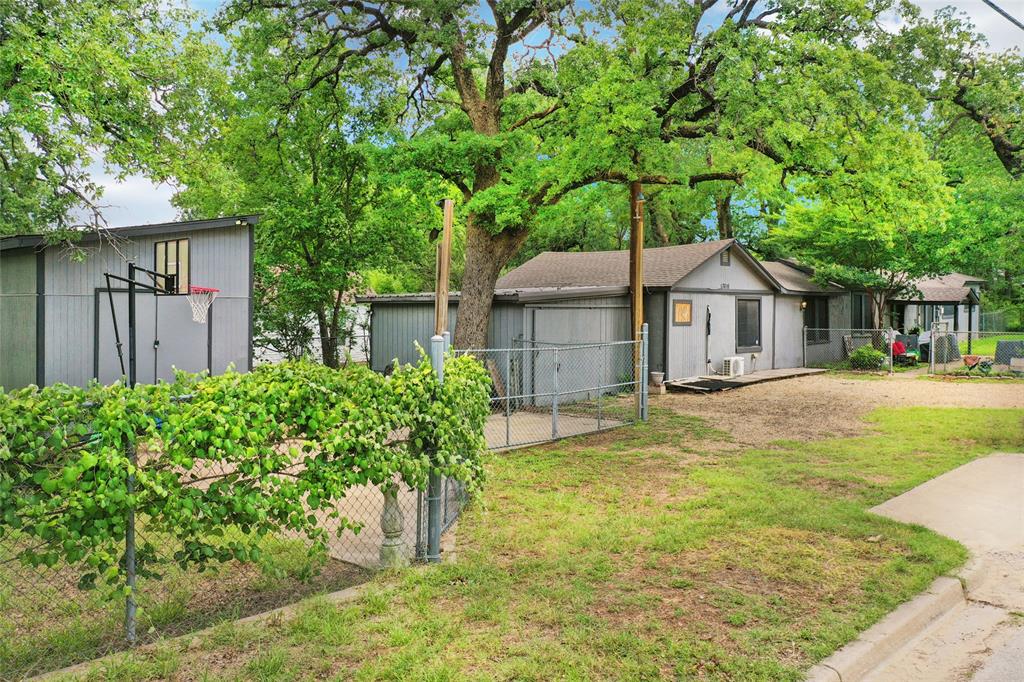 This home is sitting on a tree-shaded lot just a short walk from Lake Worth. This home offers a wonderful opportunity to add your personal touch and make it your own. Mature trees provide plenty of shade and character, creating a peaceful outdoor setting to enjoy year-round.
The property features two detached storage buildings, offering abundant space for tools, equipment, hobbies, or extra storage. One of the buildings is equipped with electricity, making it ideal for a workshop or creative workspace.
Inside, the home offers a comfortable layout and comes complete with all kitchen appliances, as well as a washer and dryer, providing added convenience from day one. This home has great potential and a location that is hard to beat.
Enjoy the charm of a quiet neighborhood, the beauty of mature trees, and the convenience of being just moments from Lake Worth's recreational opportunities. This property is ready for its next chapter, come see the possibilities for yourself!





All information is deemed reliable and true, but buyer and buyer agent to verify.