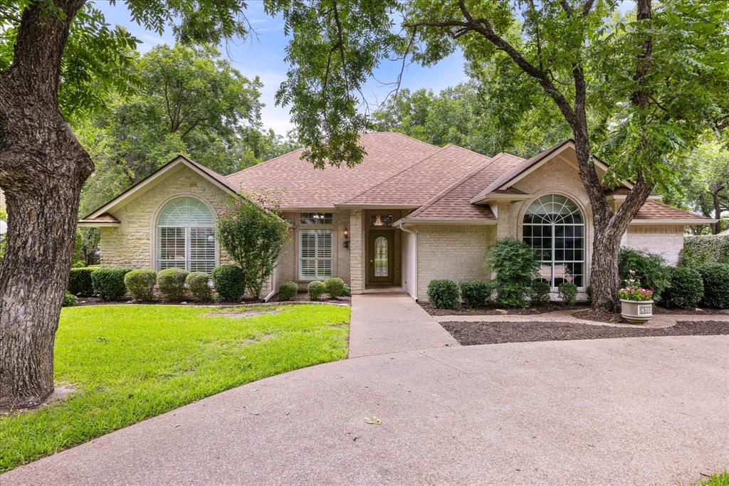 Welcome to one of Pecan Plantation's most desirable addresses—nestled on picturesque Monticello Court, a premier circle street known for its beautiful homes, mature landscaping, and convenient location near the front gate. This exceptional residence offers the perfect blend of comfort, quality, and timeless appeal within Granbury's premier gated golf course community.

Thoughtfully designed with 2,049 square feet, this well-maintained 3-bedroom, 2-bath home with a generous study offers a floor plan that lives far larger than its size. Filled with natural light, the spacious living area flows seamlessly into the dining and kitchen spaces, creating an inviting setting for everyday living and entertaining. Generous room sizes, abundant storage, and flexible living spaces provide comfort and functionality throughout.

Pride of ownership is evident at every turn. Unlike many homes of similar vintage, this property is truly move-in ready while offering the opportunity for a new owner to personalize cosmetic finishes over time. The oversized two-car garage includes a dedicated golf cart storage area—an ideal feature for embracing the Pecan Plantation lifestyle. A new roof installed in 2026 provides additional value and peace of mind.

Outside, mature landscaping enhances the home's curb appeal and welcoming presence.

Residents of Pecan Plantation enjoy an unmatched lifestyle with championship golf, marina access on the Brazos River, swimming pools, parks, walking trails, tennis, pickleball, equestrian facilities, dining, clubhouse activities, and 24-hour gated security. Conveniently located on the Fort Worth side of Granbury, the community offers easy access to DFW while remaining just minutes from historic downtown Granbury, Lake Granbury, shopping, dining, and medical services.

Come experience why Granbury has been voted Best Historic Small Town in America for five consecutive years—and discover all that this exceptional home and community have to offer.