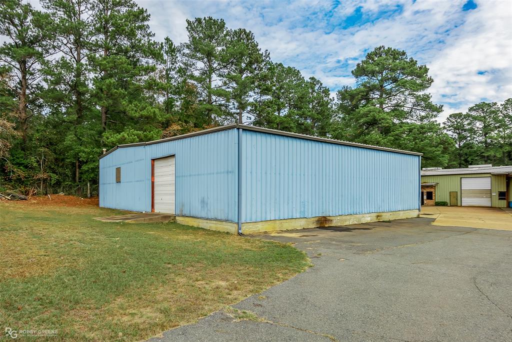 Prime industrial opportunity in Minden located off Industrial Drive. This property features approximately 24,670 square feet of office and warehouse space situated on 1.4 acres and is zoned industrial, making it ideal for a variety of business uses.

The front portion of the office has been recently remodeled, offering updated workspace along with individual offices, a kitchen, and a bathroom. A recently added studio apartment provides additional flexibility for on site living, rental income, or office use. The upstairs area has also been converted into an unfinished apartment, offering future potential for expansion or customization.

The warehouse space includes 7 large overhead doors, multiple work areas, and has been reconfigured with access adjustments including separation from the long hallway warehouse section. The neighboring property has been sold, and a fence has been installed to define the boundary. A new 2 inch water line is also being installed, adding value and utility to the property.

While some equipment has been sold, including CNC equipment and most punch presses, several key pieces will remain with the property. Included equipment consists of punch presses, band saws, lathes, and a robotic arm welder, providing immediate operational capability.

This property offers a strong combination of functional industrial space, recent updates, and future potential, making it an excellent opportunity for an owner occupant or investor.