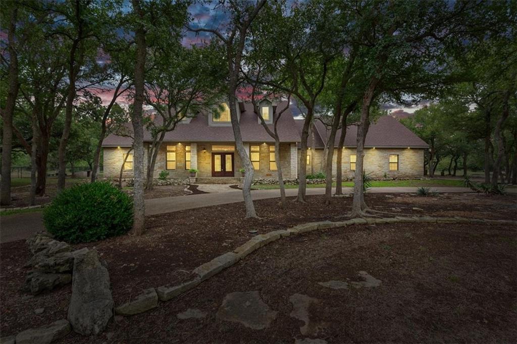 Welcome to the lovely, coveted Three 17 River Oaks Addition in Crawford.  Towards the end of an established, shaded neighborhood, and sitting on over two acres, this gorgeous home is only missing YOU!  With countless mature shade trees, a wide-open backyard, and an incredible workshop, you'll be madly in love before you even step inside.  But once you do....you'll be completely enamored with the open floor plan featuring a breakfast area, built-in office area, bar seating, and yet still a formal dining room. The living room has vaulted ceilings, an abundance of large windows, and a beautiful wood-burning fireplace. The isolated primary suite is spacious and inviting, and it includes a separate tub and shower, two separate vanities, and two walk-in closets.  On the other end of the home, you'll find two more bedrooms, with two full bathrooms, in addition to a fabulous game/media room with an attached bonus area and patio access.  This home is perfect for large family gatherings and entertaining all your favorite guests.  With a large utility room, additional half-bath for guests, plenty of storage, and a built-in pizza oven, this one truly lacks nothing.
