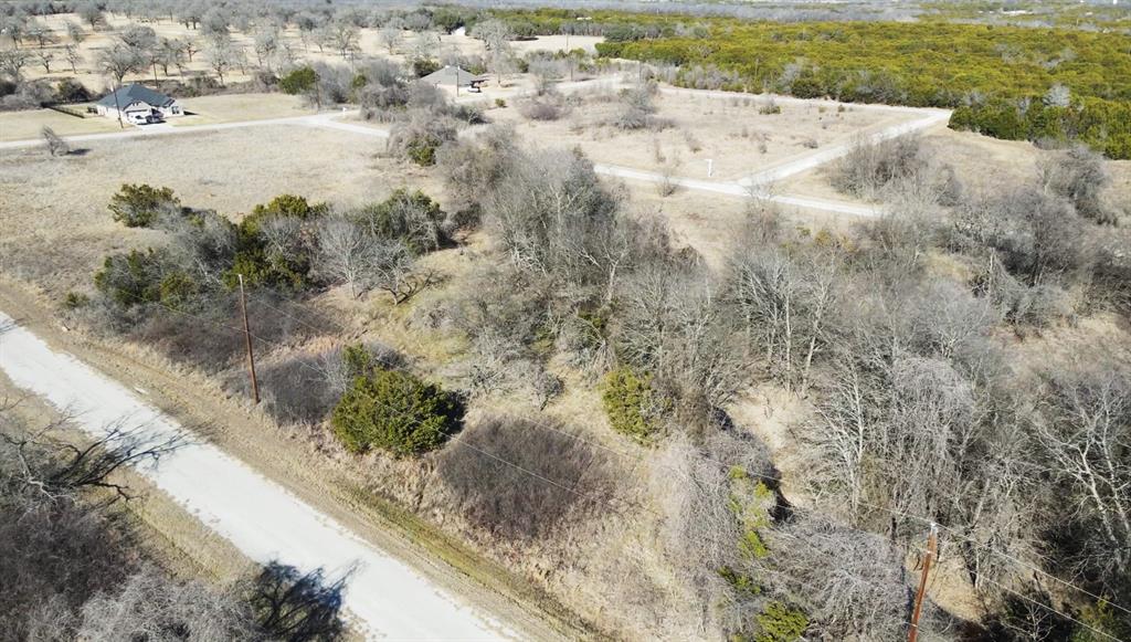 Build your dream home or weekend getaway near Lake Whitney in a vibrant resort style community designed for recreation, relaxation, and lake area living. This homesite offers a great opportunity to enjoy the beauty of North Texas while having access to a wide range of exclusive amenities.

Property owners receive an impressive amenity package that includes 36 rounds of golf per year, with 18 rounds available every six months, along with access to four community swimming pools, pickleball courts, and tennis courts. Residents also enjoy exclusive discounts on stays at the Inn, Condos, and Cabins, making it easy to host visiting family and friends while experiencing the full resort lifestyle.

The community also offers excellent options for dining and entertainment. Enjoy casual dining at Mulligans restaurant or visit the 19th Hole stadium style eatery located on the old course. The nearby marina features a market and convenience store offering pizza, burgers, drinks, and everyday essentials, making lake days simple and enjoyable.

For gatherings and special occasions, property owners receive preferred pricing on the Lone Star Room, Conference Center, and pool facilities, providing ideal spaces for private events and celebrations.

Located near the shores of Lake Whitney, this property offers the perfect balance of peaceful surroundings and active resort living. Whether you are planning to build now, create a weekend retreat, or invest for the future, this lot provides access to exceptional amenities and a lifestyle that feels like vacation every day.