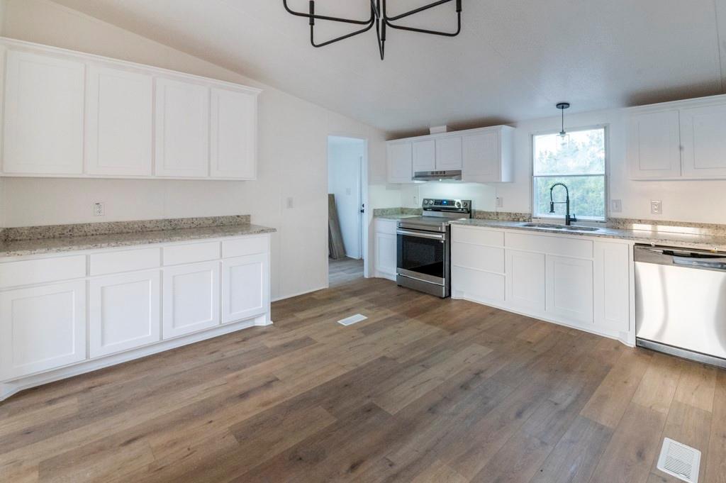 **$5000 in Seller Concessions** Charming recently remodeled 3 bedroom 2 bath home - No HOA! Discover your dream home just outside city limits. Step inside to find an open, inviting layout featuring granite countertops, luxury vinyl plank flooring, brand-new carpet, and fresh paint throughout.